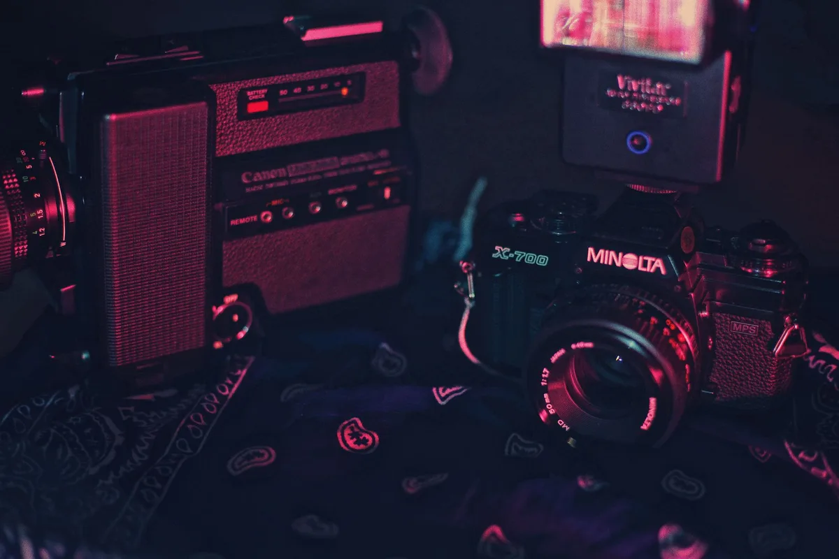 Array of vintage Canon camera lenses and professional photography equipment