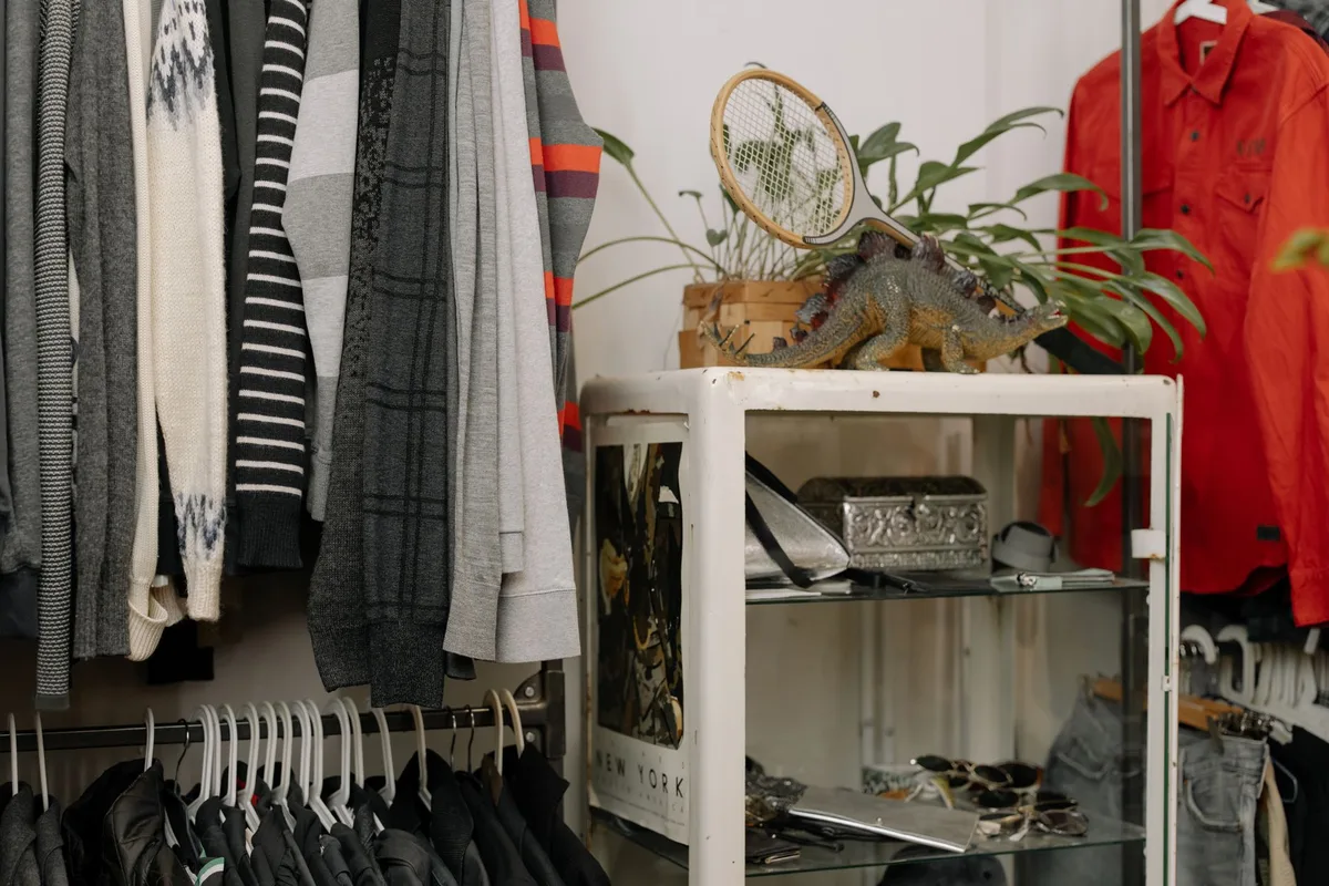 Well-organized thrift store with clearly marked clothing sections