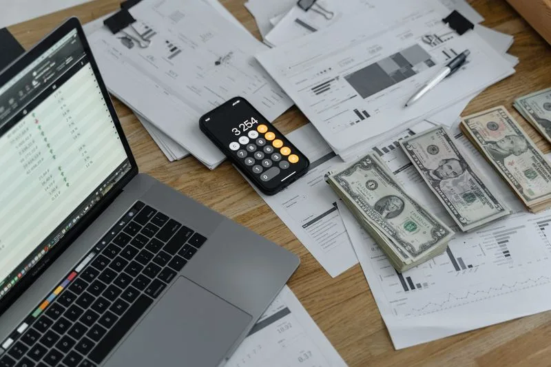 Small business owner reviewing paperwork at desk