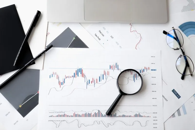 Calculator and financial documents on organized desk