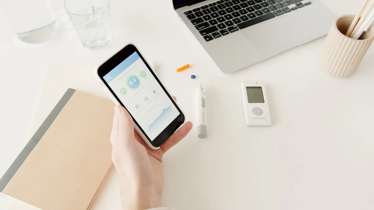 Person testing smartphone screen functionality and checking for defects