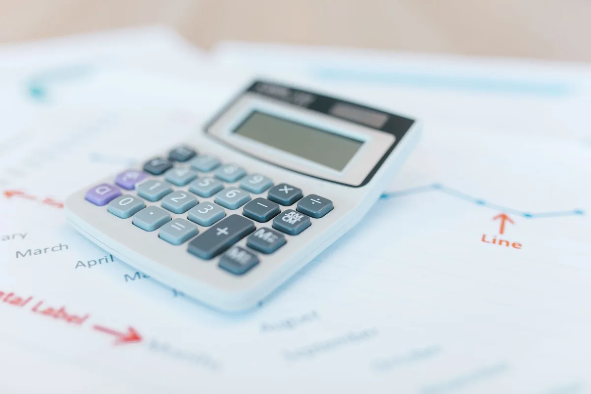 Savings jar with calculator for quarterly tax planning