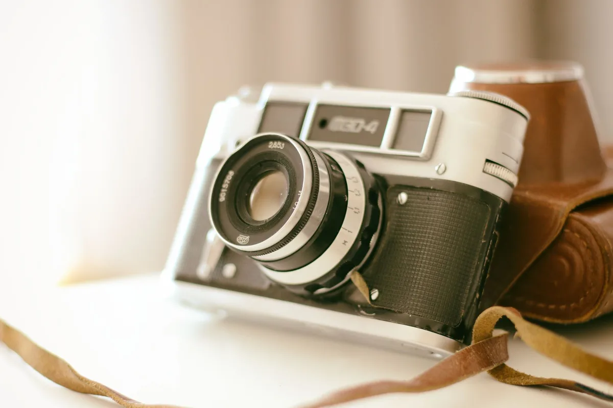 Collection of vintage camera equipment and photography accessories arranged for sale